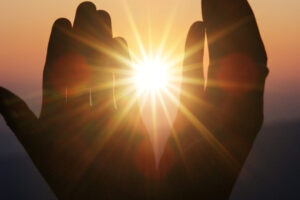 faith of christian concept: spiritual prayer hands over sun shin